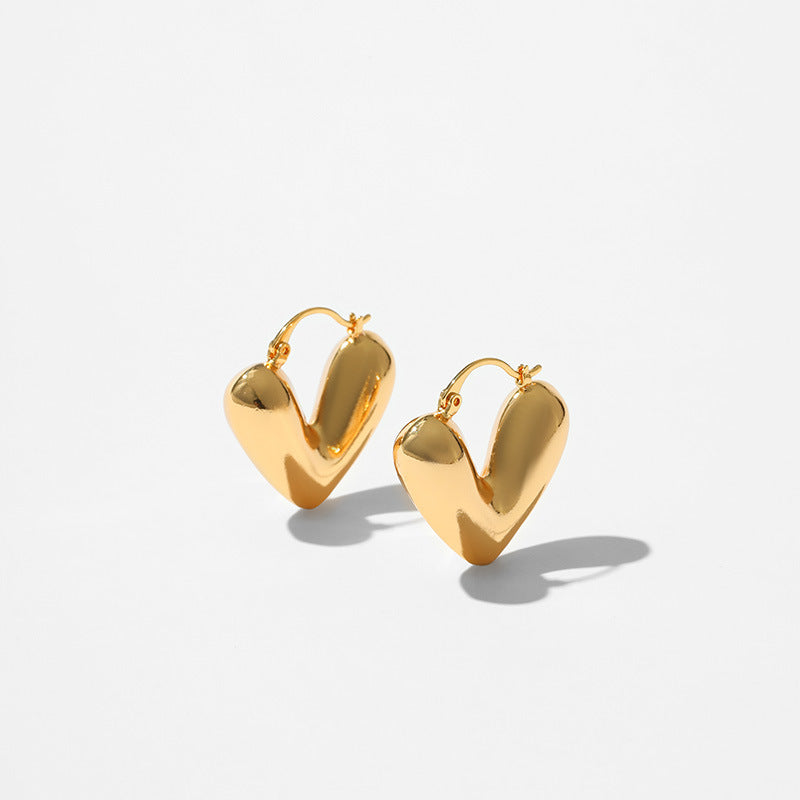 Product information: Treatment Process: Electroplating Color: KE1236 Applicable population: Female Material: Copper Purity: 18K Shape: heart shape Packing list: Earrings *1 pair Product Image: