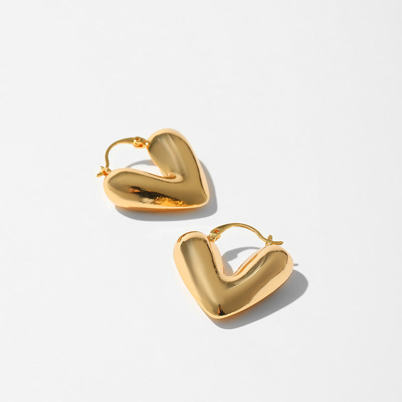 Product information: Treatment Process: Electroplating Color: KE1236 Applicable population: Female Material: Copper Purity: 18K Shape: heart shape Packing list: Earrings *1 pair Product Image: